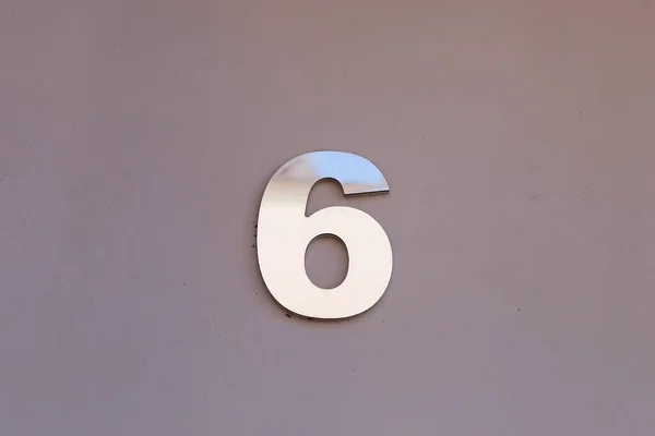 number six in metallic plate format, with copy space and gray tone - 6
