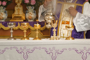 Chalice and ambula being incensed, rite of the holy mass - Consecration of bread and wine in the body and blood of Jesus - Sacred Host