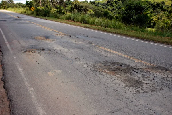 highway roof with defective and spoiled asphalt, dangerous for traffic