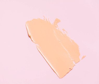 Temelinin dokusu makyajın altında bej. Fikirleriniz için güzel desenli arka plan