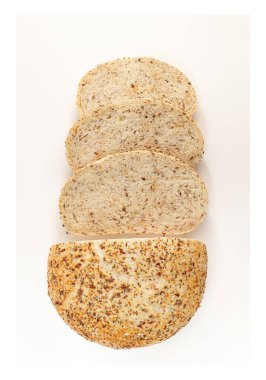 Creative layout made of breads on white background. Flat lay. Food concept. Art food. Sliced, cutted wheat bread. Top view. Food abstractions.