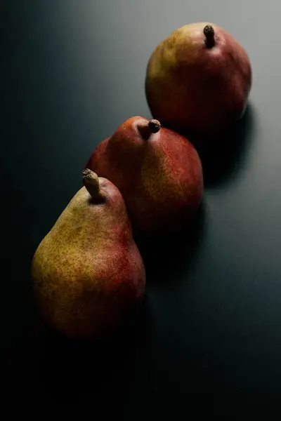 Three Red Pears Black Table High Quality Photo — Foto de Stock