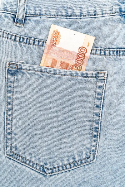 Banknotes in the pocket of blue jeans. russian 5000 banknote — Stock Photo, Image