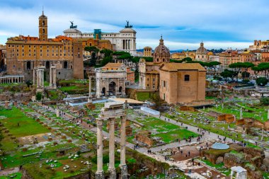 December 4, 2022 - Rome, Italy: Panoramic view over Forum Romanum with ruins of Temple of Saturn, Temple of Castor and Pollux, arches and columns remains.