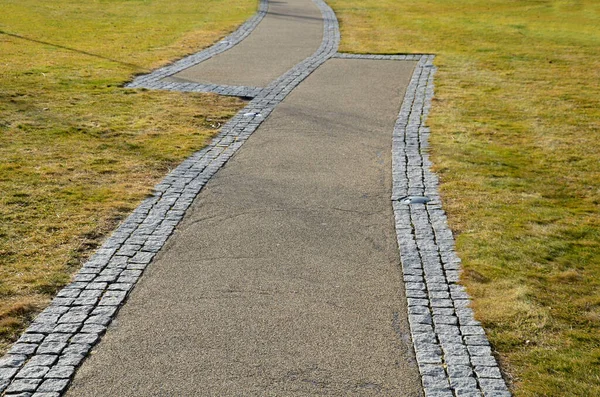 the two paths in park go right next to each other connect only the edges. it looks like construction companies haven't hit and built roads so that they don't get together. project error or design whim