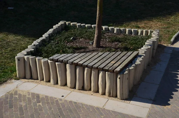 Palisades made of wood poles of various shapes and profiles are widely used especially in garden architecture solving smaller height differences, for edging raised flower beds, ornamental grass areas
