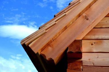 The wooden cabin is made using wooden timber technology without the use of nails and screws. Sindel roof on a mountain hut newly built without the use of screws as a kit.