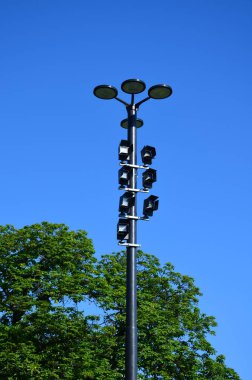 column with special lighting for scenic lighting of public and historic buildings in city. Halogen lamps have side flaps that shade so that they do not dazzle other people, drivers and neighborhood