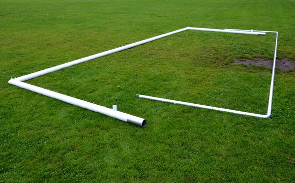 Football Goal Installation Metal White Structure Lies Soccer Field Excavated — Zdjęcie stockowe
