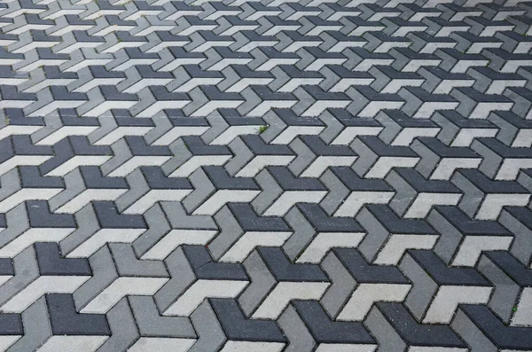 Betonpflaster Mit Geometrischen Formen Und Grautönen Erzeugt Einen Dreidimensionalen Eindruck — Stockfoto