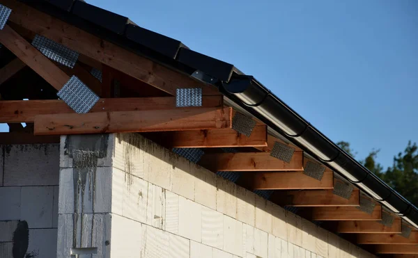 The trusses are made from high-quality, strength-graded lumber and connected by steel buttplates with pressed mandrels. gutters and bags of gray color. white silicate bricks,havedormerslanted sides.