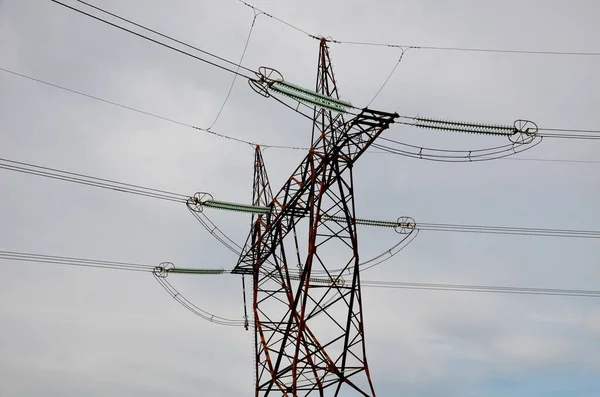 electrical network huge long line. feeds the entire network from the power plant. the danger of blackout scares every household. city without electricity where no energy flows anymore. glass insulator