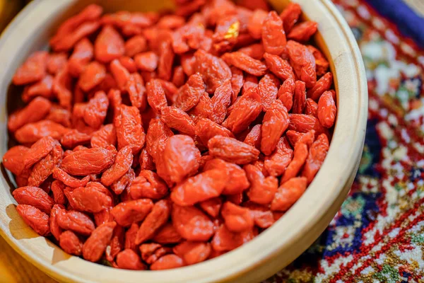 There are many naturally dried red wolfberries on the table