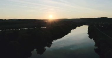 Aerial drone shot above river with view to landmarks
