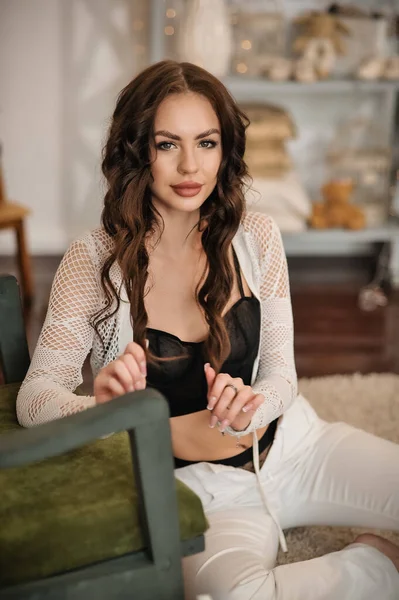 Beautiful Young Woman Black Dress White Shirt Sits Sofa Room — ストック写真