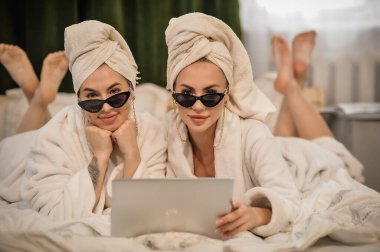 beautiful young women in bathrobe and towel relaxing in the spa.