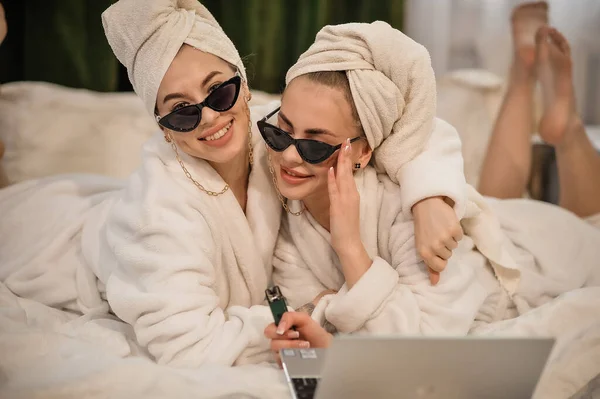 young women with laptop and coffee in the city