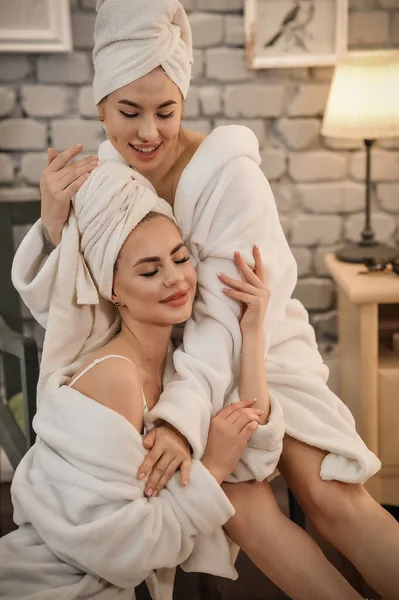 Beautiful Young Woman Bathrobe Towel Her Face Smiling While Sitting — ストック写真