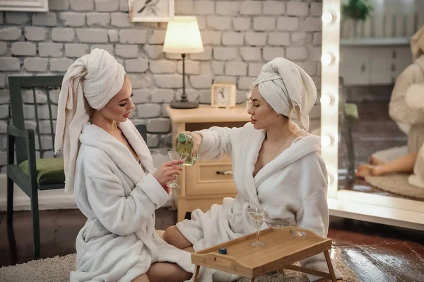 Beautiful Young Women Bathrobes Sitting Couch Drinking Coffee Spa — Stock fotografie