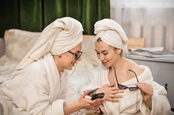 Beautiful Girls White Bathrobe Her Hair Towel Looking Smartphone Apartment — Stock Photo, Image