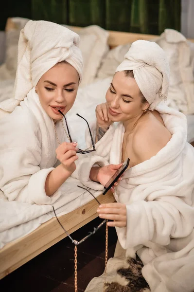 Two Women Bathrobe Lying White Towel Brush — Stok fotoğraf