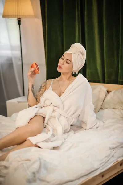 Beautiful Young Woman Bathrobe White Robe Lying Bed Bedroom — Stock Photo, Image