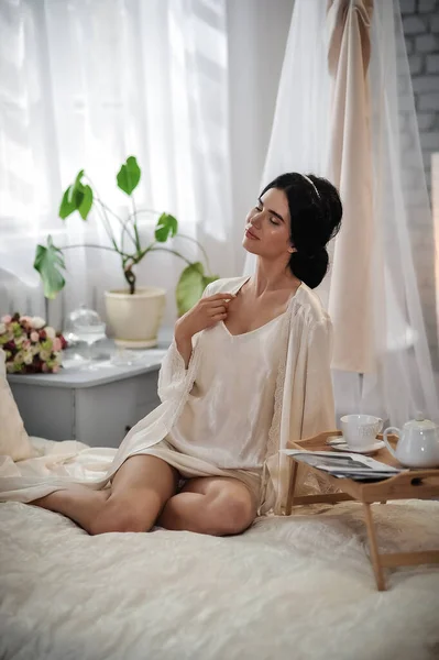 Beautiful Young Woman White Dress Sitting Bed Drinking Coffee — 스톡 사진
