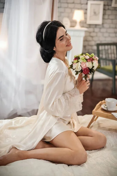 Beautiful Young Woman Long Hair White Dress Sitting Bed Flowers — Stockfoto