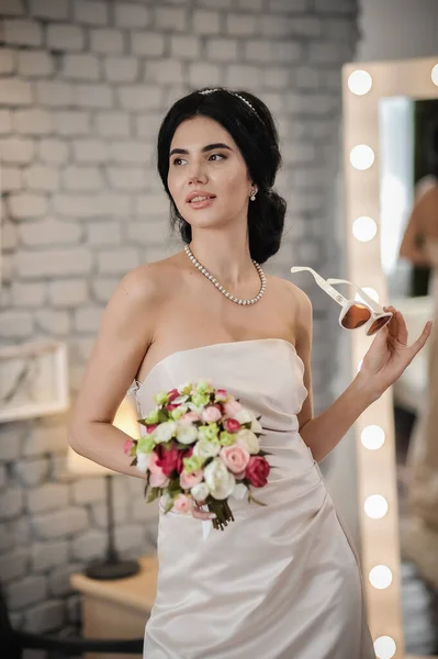 beautiful bride with long hair in a white dress