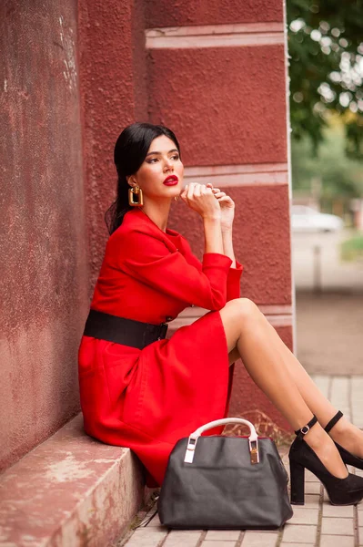 Beautiful Young Woman Red Dress Black Jacket Handbag Background Street — Φωτογραφία Αρχείου