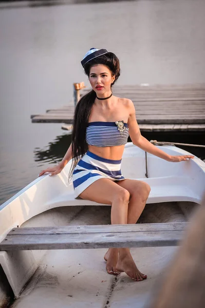 sexy young woman on the yacht in the port of kotor