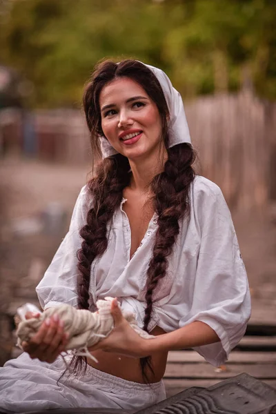 Beautiful Young Woman White Dress Hat Sitting Wooden Bench Garden — Stock Fotó