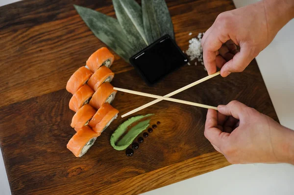 Close Delicious Sushi Chopsticks Salmon Wooden Cutting Board — Stock Photo, Image