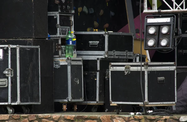 boxes containing speakers and lighting equipment in stage assembly for a recital, rock festival backstage
