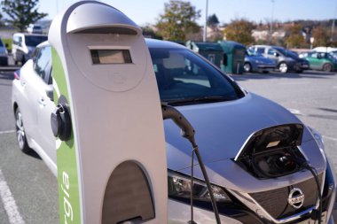 PAMPLONA, NAVARRA SPAIN JANUARY 13 2022: Electric car charging next to charging station