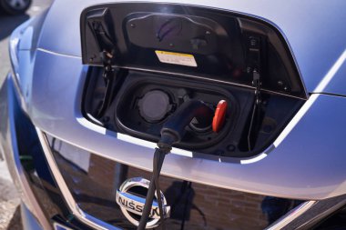 PAMPLONA, NAVARRA SPAIN JANUARY 13 2022: Electric car charging next to charging station