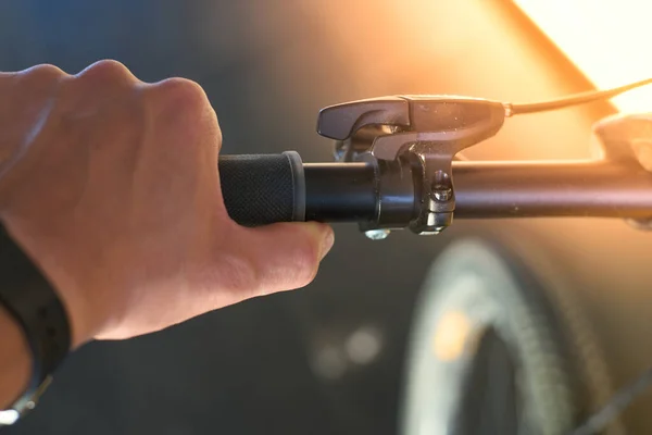 stock image Hand holding handlebars and gear lever on a mountain bike. High quality photo