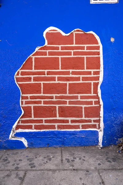 A blue and brick wall , urban photography, no people