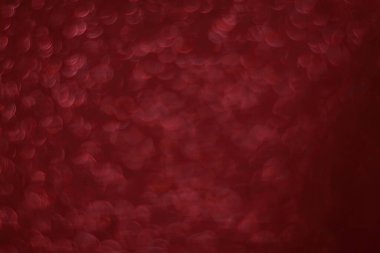 Bokeh odaklı ışıklarla kırmızı parıltılı soyut arkaplan