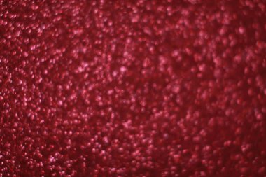 Bokeh odaklı ışıklarla kırmızı parıltılı soyut arkaplan