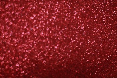 Bokeh odaklı ışıklarla kırmızı parıltılı soyut arkaplan