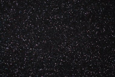 Siyah arkaplanda uçan toz parçacıkları