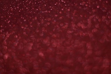 Bokeh odaklı ışıklarla kırmızı parıltılı soyut arkaplan