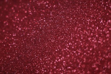 Bokeh odaklı ışıklarla kırmızı parıltılı soyut arkaplan