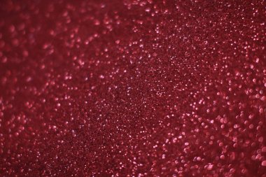 Bokeh odaklı ışıklarla kırmızı parıltılı soyut arkaplan