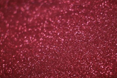 Bokeh odaklı ışıklarla kırmızı parıltılı soyut arkaplan