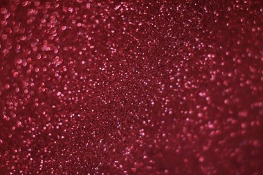 Bokeh odaklı ışıklarla kırmızı parıltılı soyut arkaplan