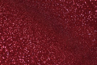 Bokeh odaklı ışıklarla kırmızı parıltılı soyut arkaplan