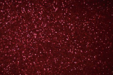 Bokeh odaklı ışıklarla kırmızı parıltılı soyut arkaplan