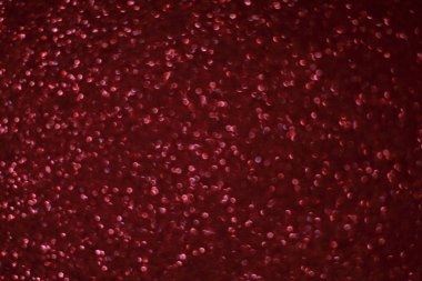 Bokeh odaklı ışıklarla kırmızı parıltılı soyut arkaplan